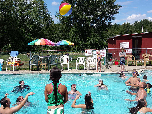 Families enjoying the campground swimming pool